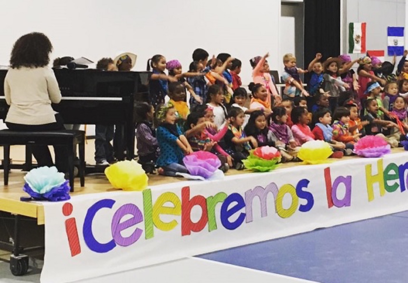 Students celebrating Hispanic Heritage Month on stage